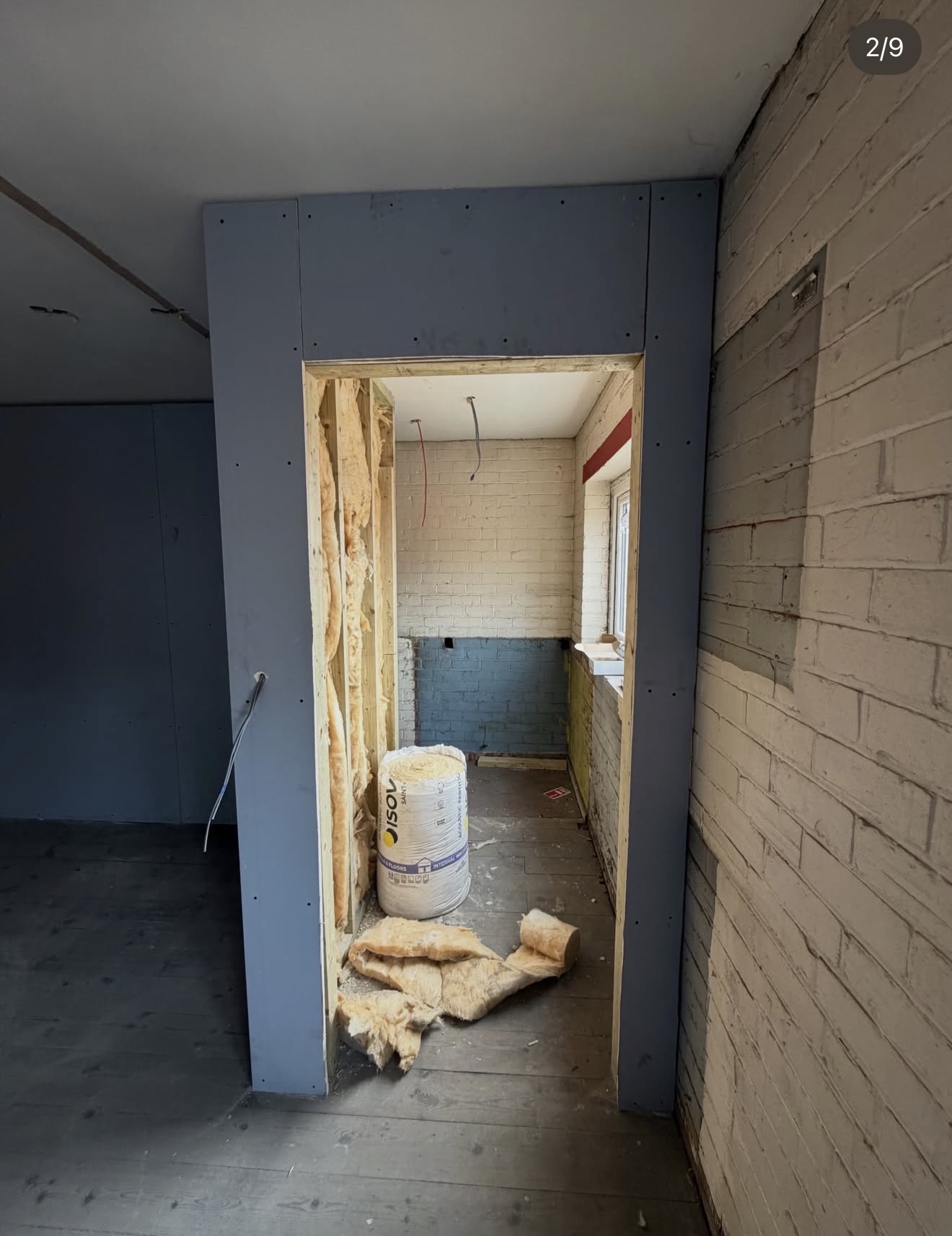 Warehouse HMO conversion showing a framed doorway and internal build-out